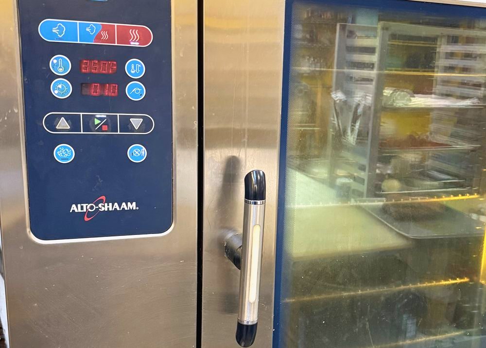 Appliance Rescue Team technician repairing a commercial combi oven in Bergen County, NJ
