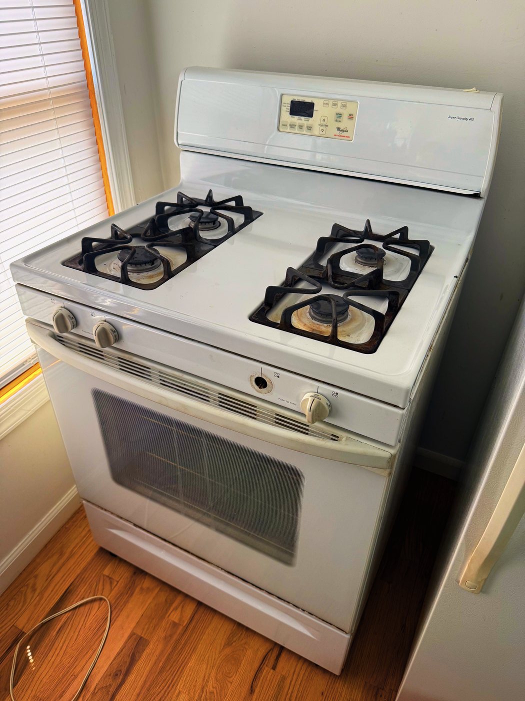 The range this repair was done on — an older Whirlpool, and by the time we saw it every burner had failed