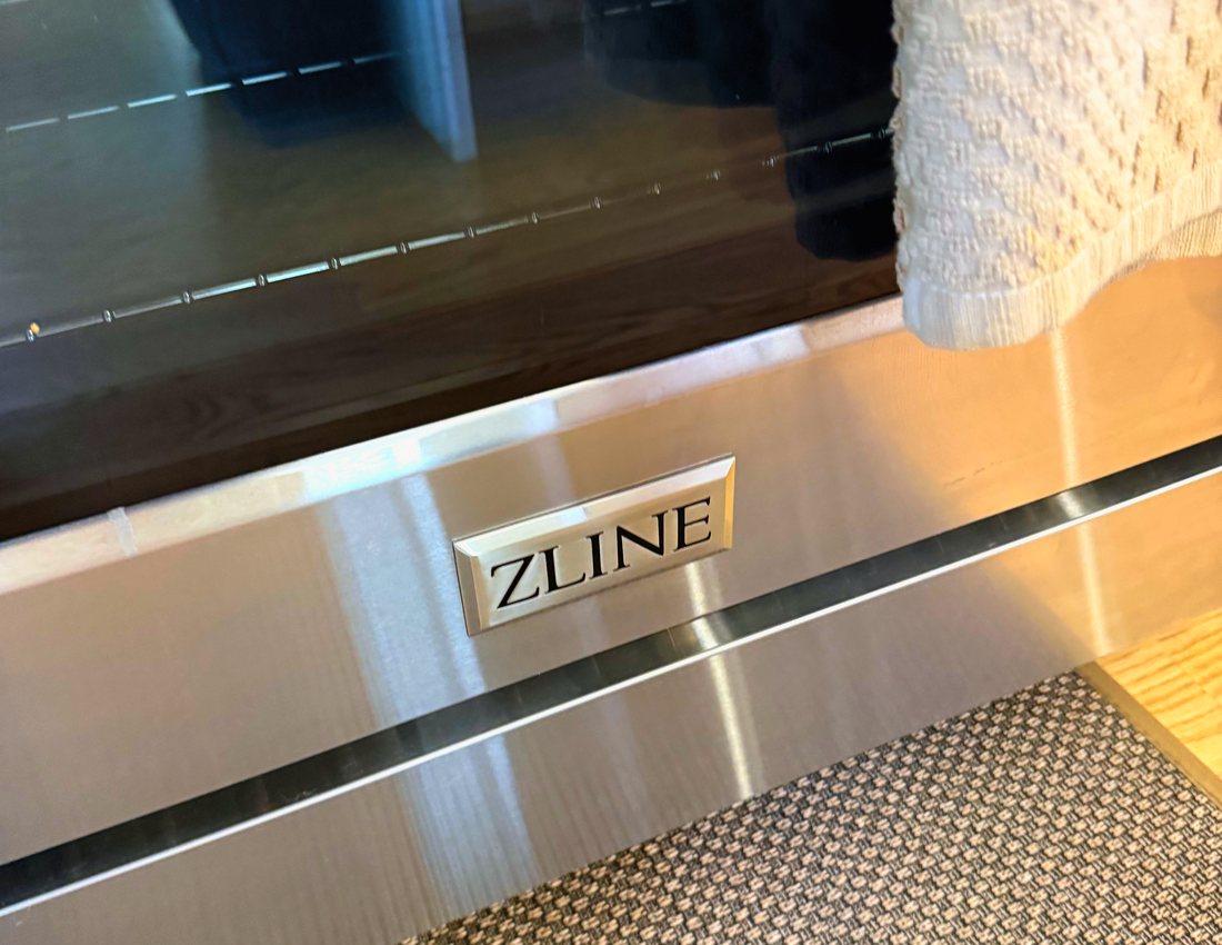 Appliance Rescue Team technician servicing a Z-Line range and oven as a factory-authorized Z-Line service provider
